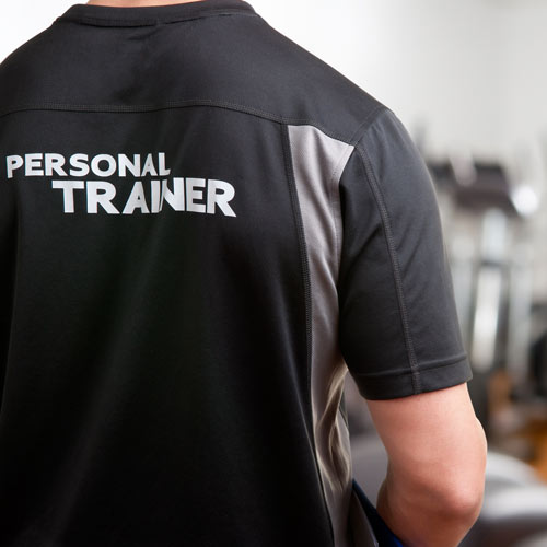 Personal trainer standing in a gym