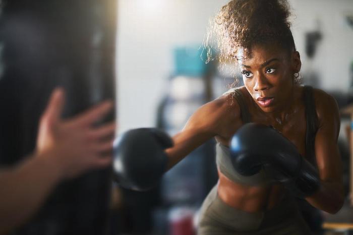 A woman boxing at the gym