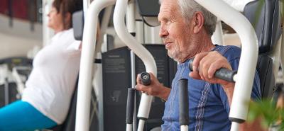 An elderly man at the gym